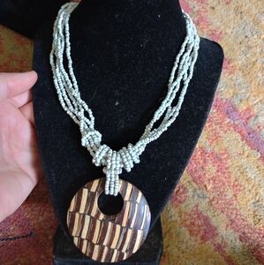 Elegant Beaded Necklace with Wooden Pendant